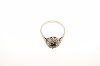 Lot 25 - 18ct white metal, sapphire and diamond cluster ring