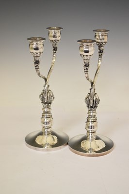 Lot 130 - Pair of Georg Jensen sterling silver two-branch candelabra