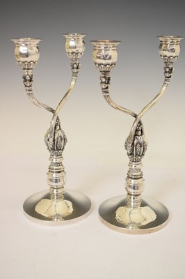 Lot 130 - Pair of Georg Jensen sterling silver two-branch candelabra