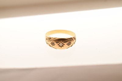Lot 26 - Unmarked gold ring, gypsy set three white stones