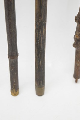 Lot 320 - Edwardian silver capped walking cane, together with four walking sticks