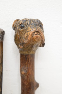 Lot 320 - Edwardian silver capped walking cane, together with four walking sticks