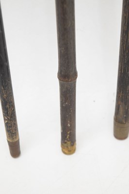 Lot 320 - Edwardian silver capped walking cane, together with four walking sticks