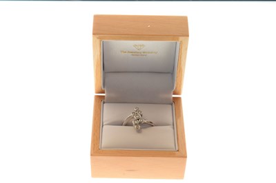 Lot 23 - 18ct white gold seven-stone diamond dress ring