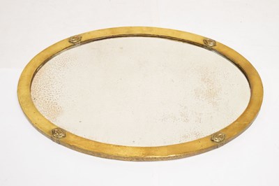 Lot 595 - Arts & Crafts brass framed oval beveled mirror