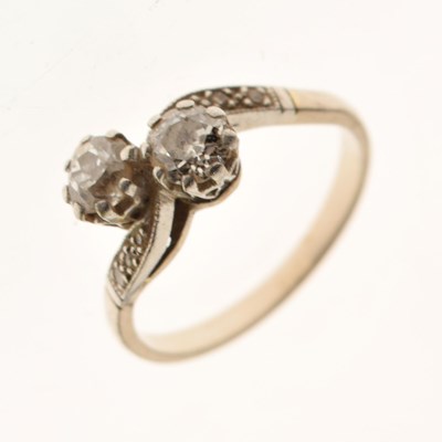 Lot 9 - 18ct white gold two-stone diamond crossover ring
