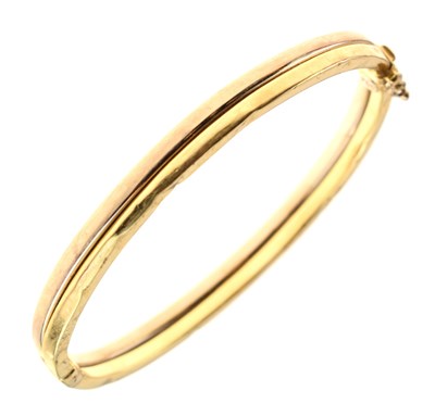 Lot 100 - 18ct two-colour gold hollow bangle