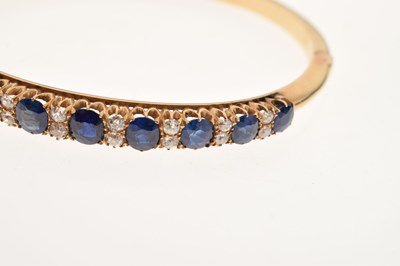 Lot 44 - Edwardian sapphire and diamond hinged bangle