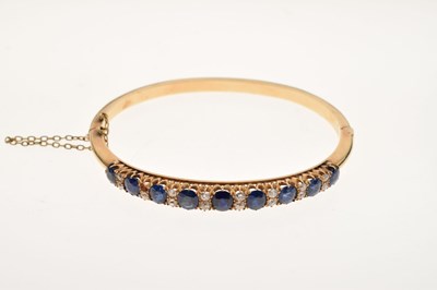 Lot 44 - Edwardian sapphire and diamond hinged bangle