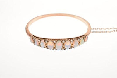 Lot 45 - Edwardian opal and diamond hinged bangle
