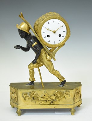 Lot 613 - Early 19th century French Empire patinated bronze and ormolu figural mantel clock