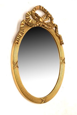 Lot 502 - Reproduction giltwood oval wall mirror