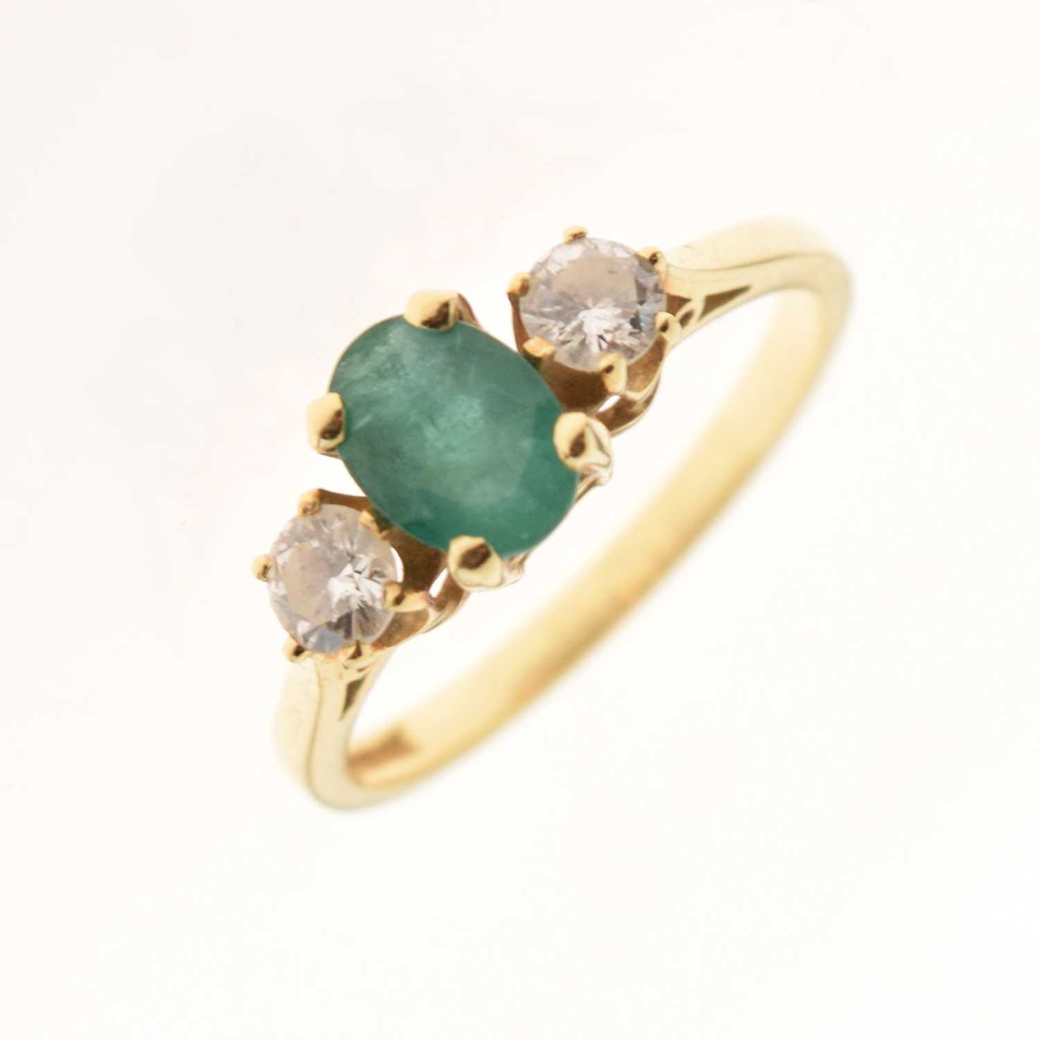 Lot 14 - 18ct gold emerald and diamond three-stone ring