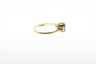 Lot 47 - 18ct gold emerald and diamond three-stone ring