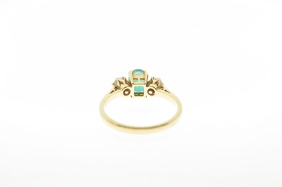 Lot 47 - 18ct gold emerald and diamond three-stone ring