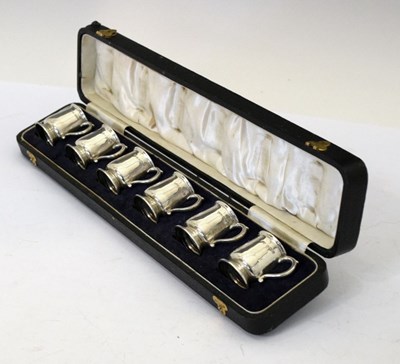 Lot 87 - Cased set of six George V silver tot measures in the form of miniature mugs