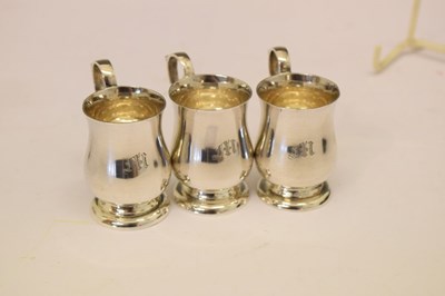 Lot 86 - Cased set of six Edward VII silver tot measures in the form of miniature baluster mugs