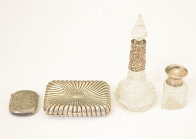 Lot 250 - Victorian silver cigarette case, a silver vesta, and two silver mounted perfume bottles