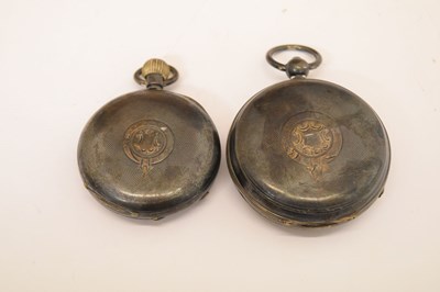 Lot 89 - Two silver open face pocket watches and holders
