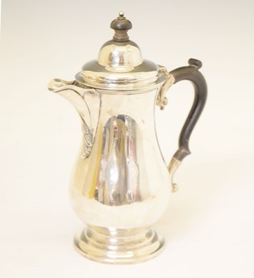 Lot 130 - George V silver baluster hot water jug