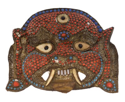 Lot 466 - Nepalese or Tibetan turquoise and coral-mounted brass mask of Mahakala