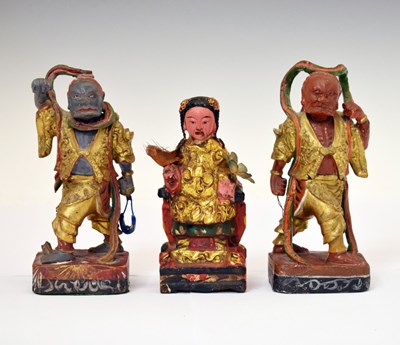 Lot 454 - Three Chinese lacquered softwood figures