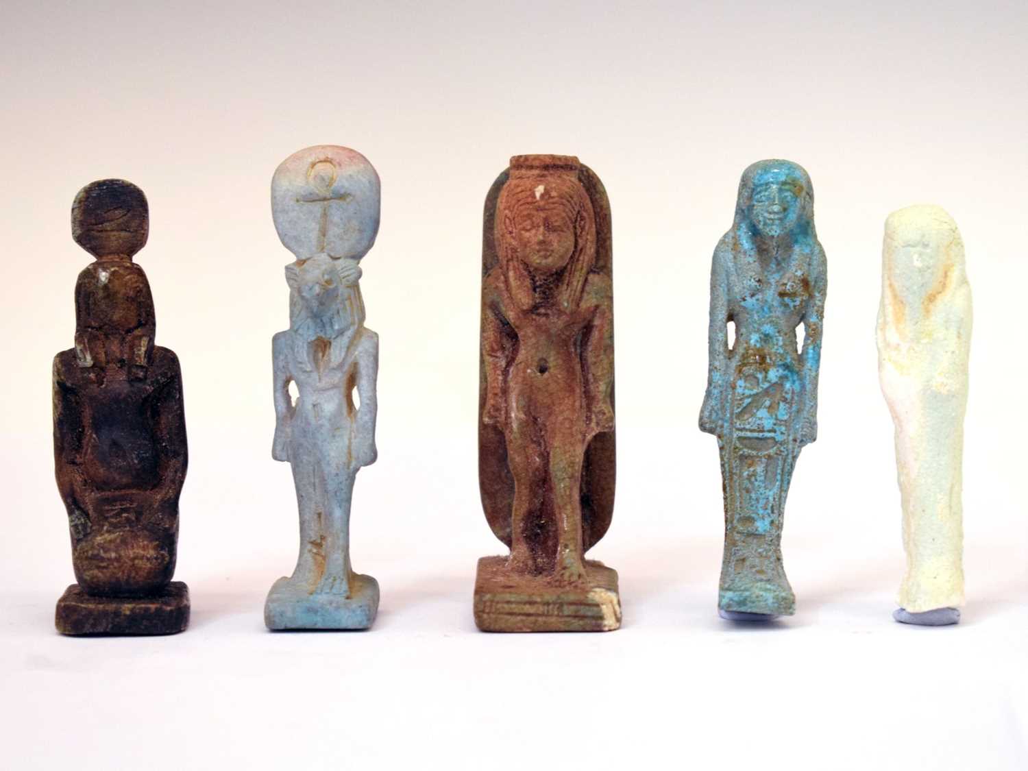 Shabti Lot 323 - Five small Egyptian shabti figures