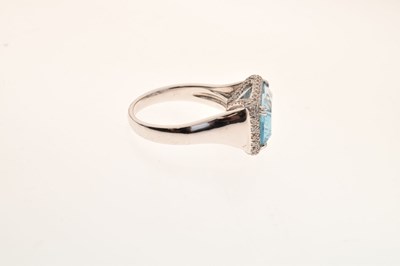 Lot 41 - 18ct white gold blue topaz and diamond dress ring