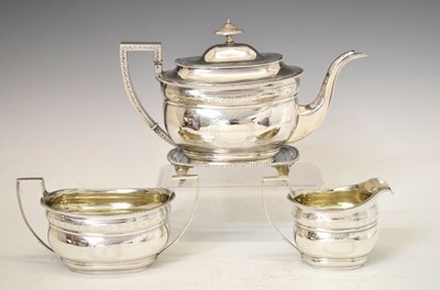 Lot 270 - George III silver tea set and teapot stand