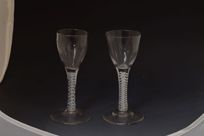 Lot 46 - Two similar opaque twist stem wine or cordial glasses
