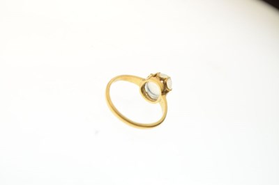 Lot 12 - Unmarked yellow metal ring  with moonstone cabochon