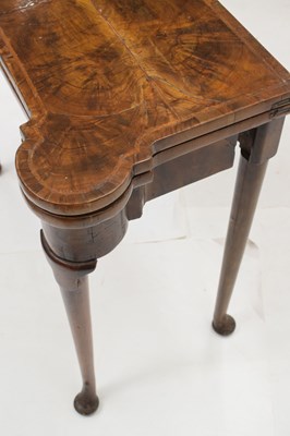 Lot 83 - Mid 18th century walnut fold-over games table