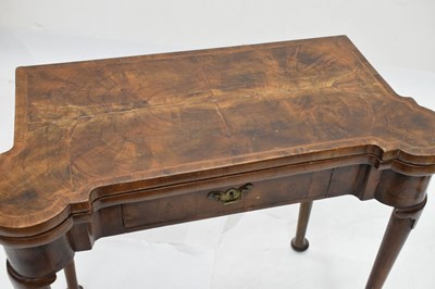 Lot 83 - Mid 18th century walnut fold-over games table