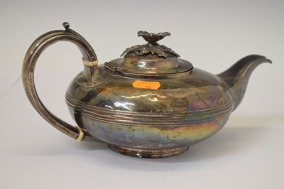 Lot 35 - William IV silver teapot of squat form with scroll handle and floral knop
