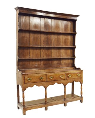 Lot 629 - George III oak potboard dresser and rack