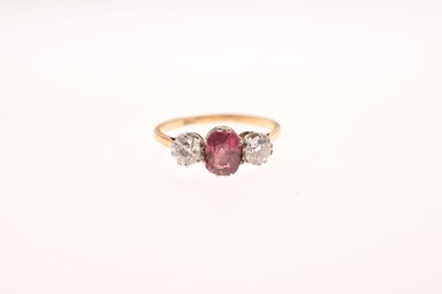Lot 40 - Pink stone and diamond three-stone ring