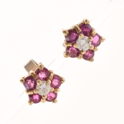 Lot 167 - Pair of ruby and diamond cluster 9ct gold ear studs