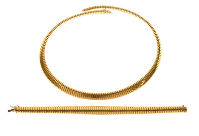 Lot 116 - Gold flexi-link necklace and matching bracelet