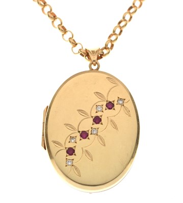 Lot 129 - 9ct gold oval locket set rubies and diamonds