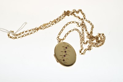 Lot 129 - 9ct gold oval locket set rubies and diamonds