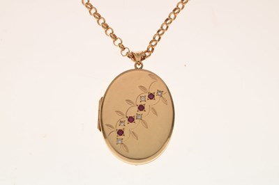 Lot 129 - 9ct gold oval locket set rubies and diamonds