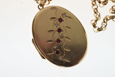 Lot 129 - 9ct gold oval locket set rubies and diamonds