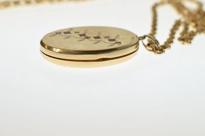 Lot 129 - 9ct gold oval locket set rubies and diamonds