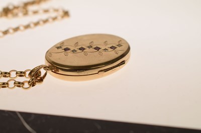 Lot 129 - 9ct gold oval locket set rubies and diamonds