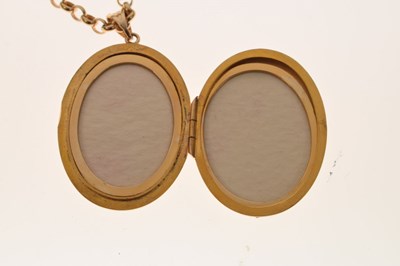 Lot 129 - 9ct gold oval locket set rubies and diamonds