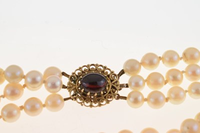 Lot 49 - Triple-strand cultured pearl necklace