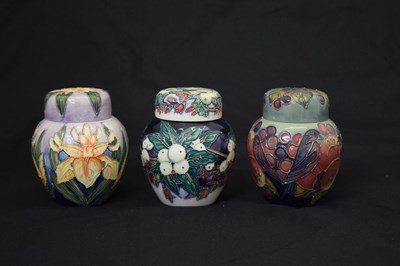 Lot 598 - Three Moorcroft ginger jars - Snowberry, Finches and Iris