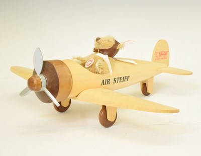 Lot 414 - Steiff - Small 12cm high teddy bear pilot with wooden 'Air Steiff' model plane