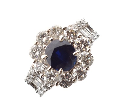 Lot 133 - Sapphire and diamond cluster dress ring