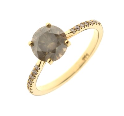 Lot 6 - Diamond single stone ring with seven small diamonds to each shoulder